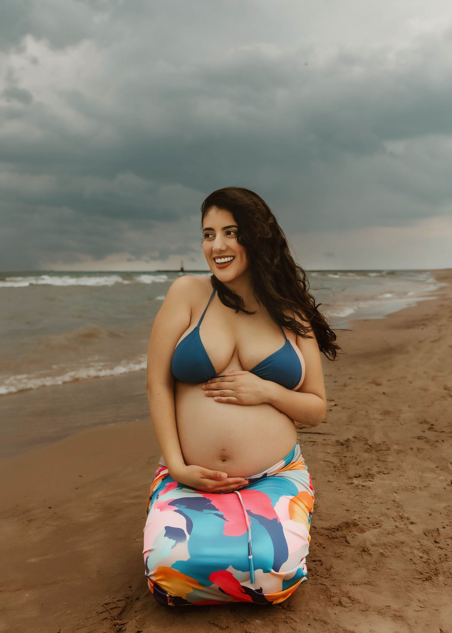 Beach Swim maternity session on overcast day on Montrose Beach in Chicago, IL