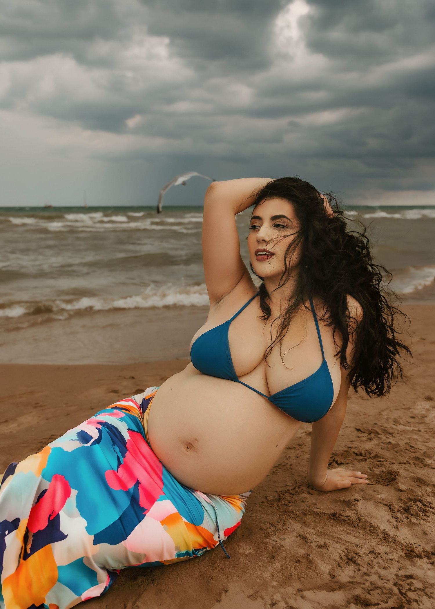 Beach and swim maternity portrait at North Ave Beach in Chicago IL, seagulls flying in the background