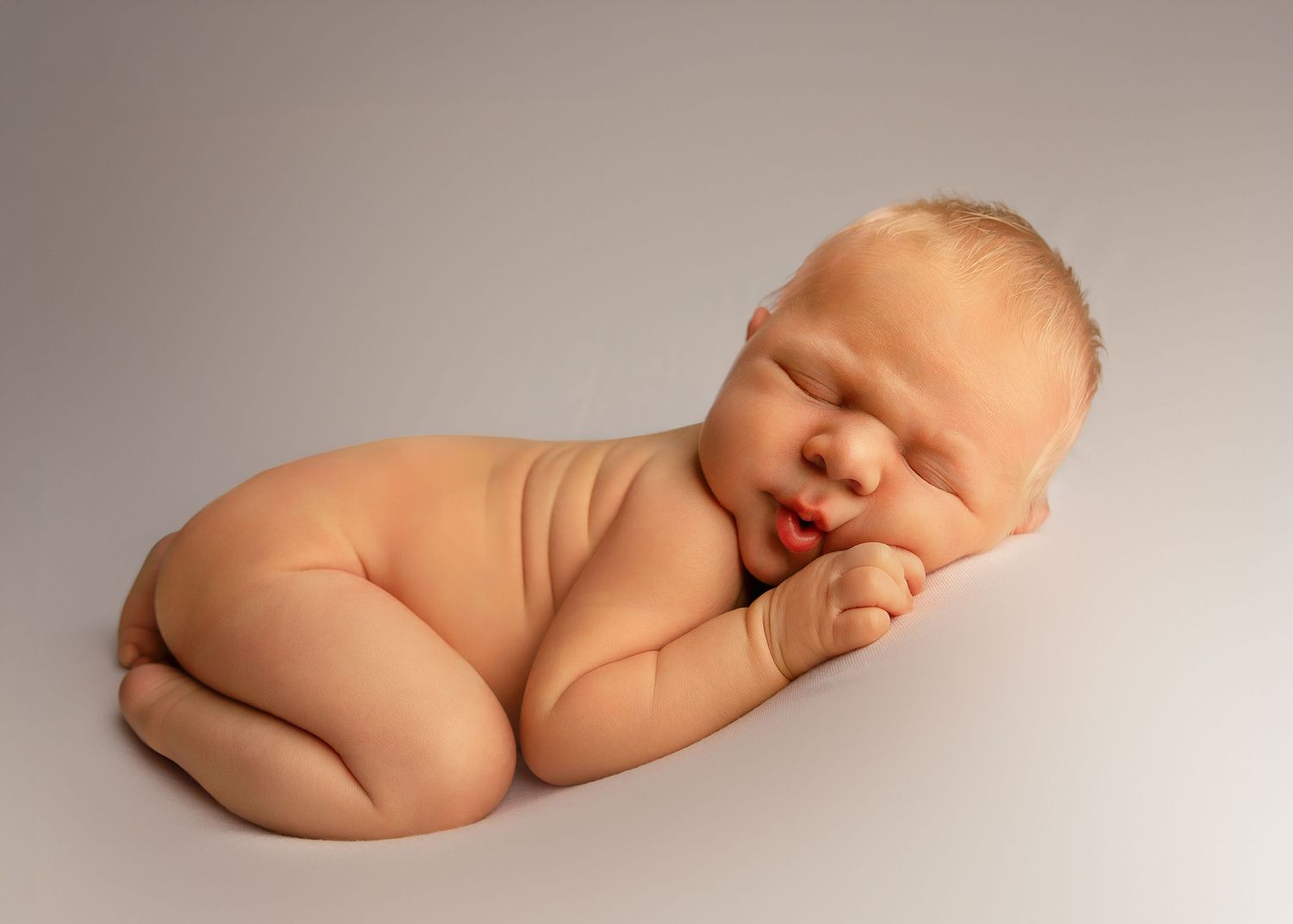 Bum up posed newborn boy photo at a studio in Peoria IL