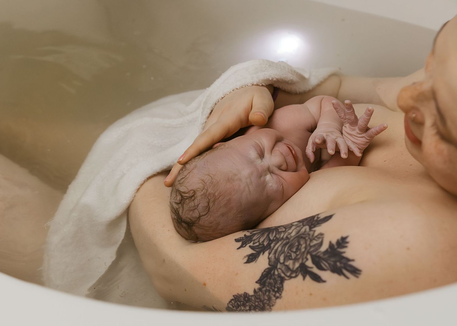 Birth Photography in tub in Bloomington, IL