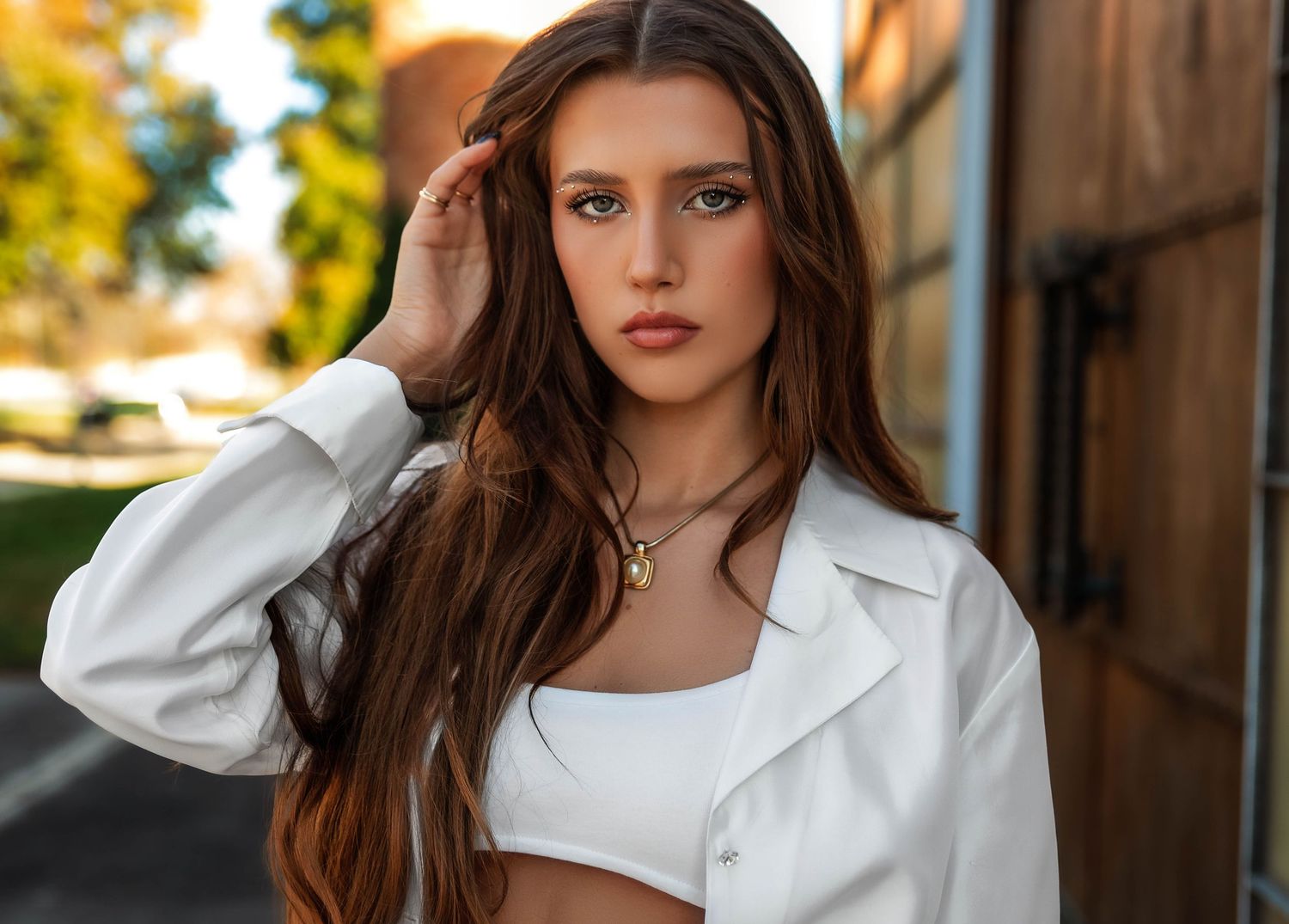 Warm and bold portrait photo in Illinois with white clothing and detailed makeup