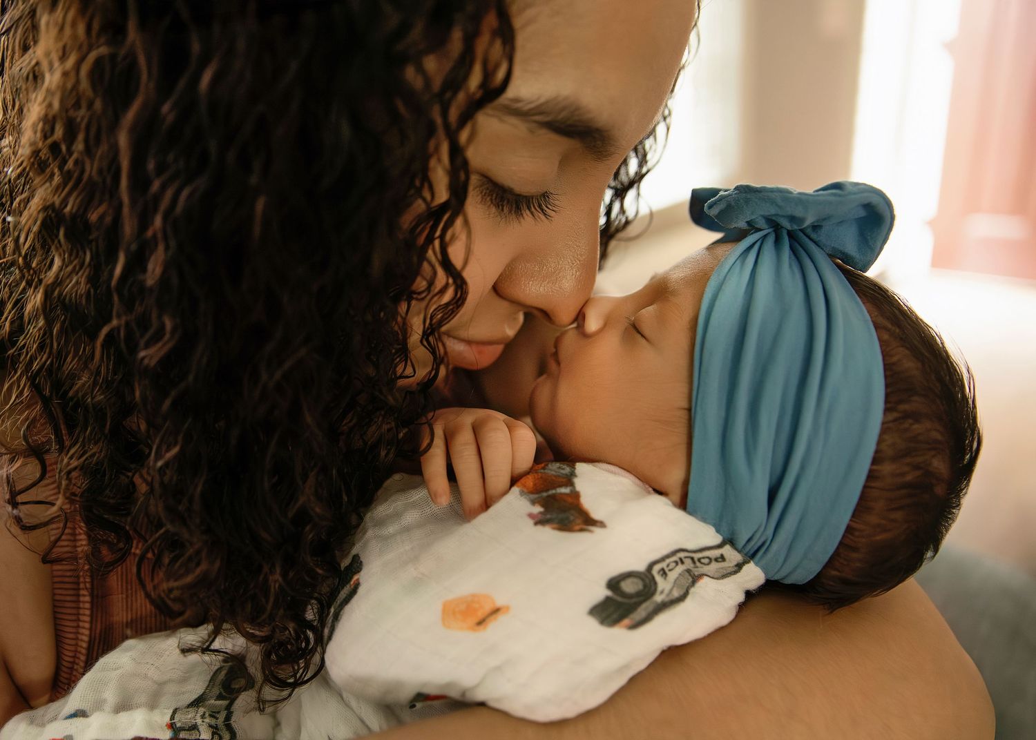 Lifestyle Newborn Photo with mom in-home
