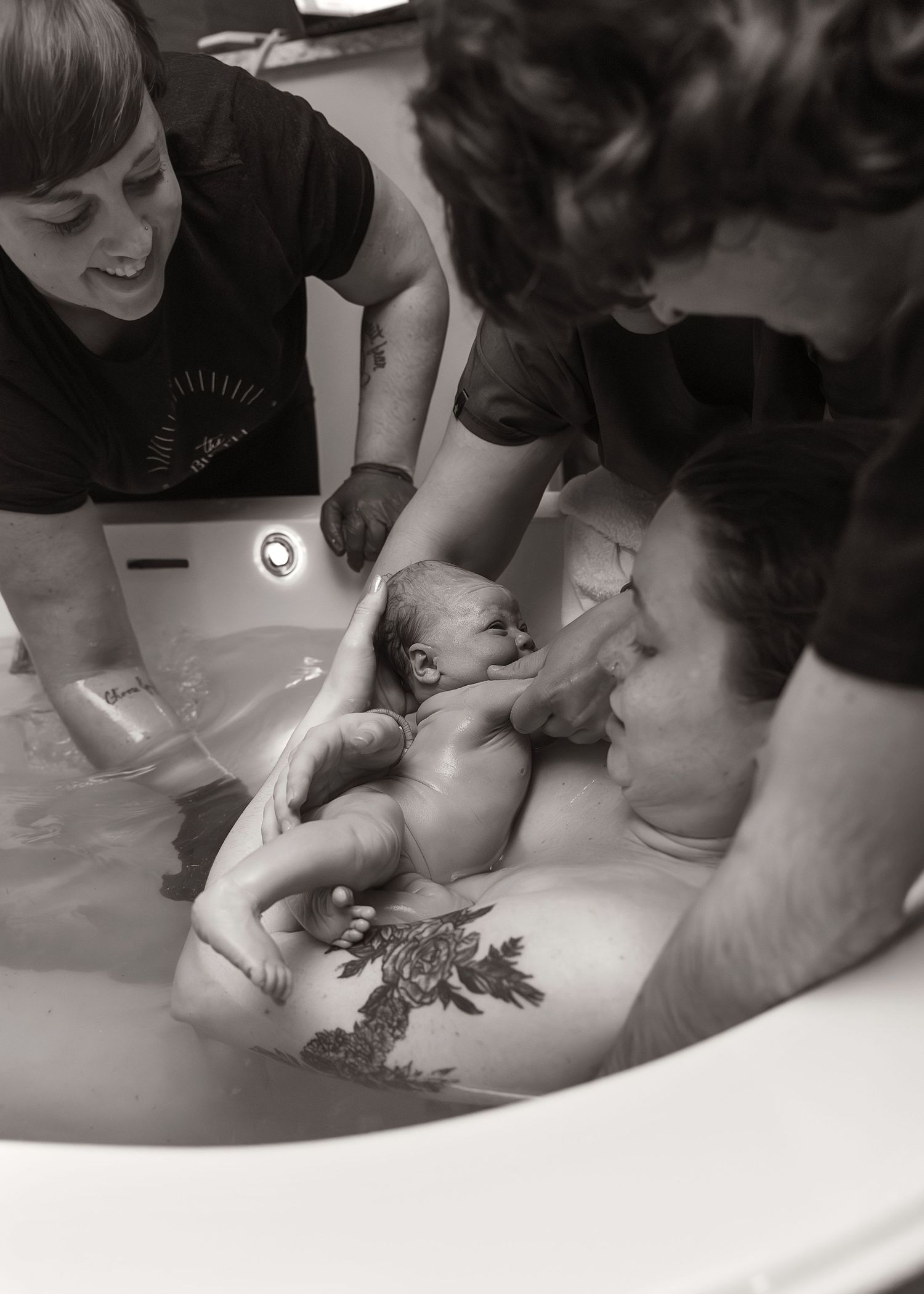 The moment you find out your baby is a girl. Birth Photography in tub in Bloomington, IL