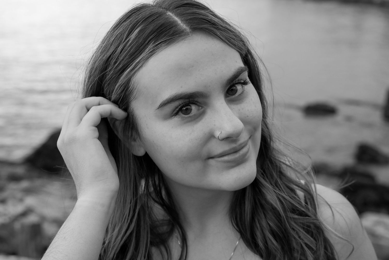 A series of black and white portrait photos showing similar poses against natural outdoor backgrounds.