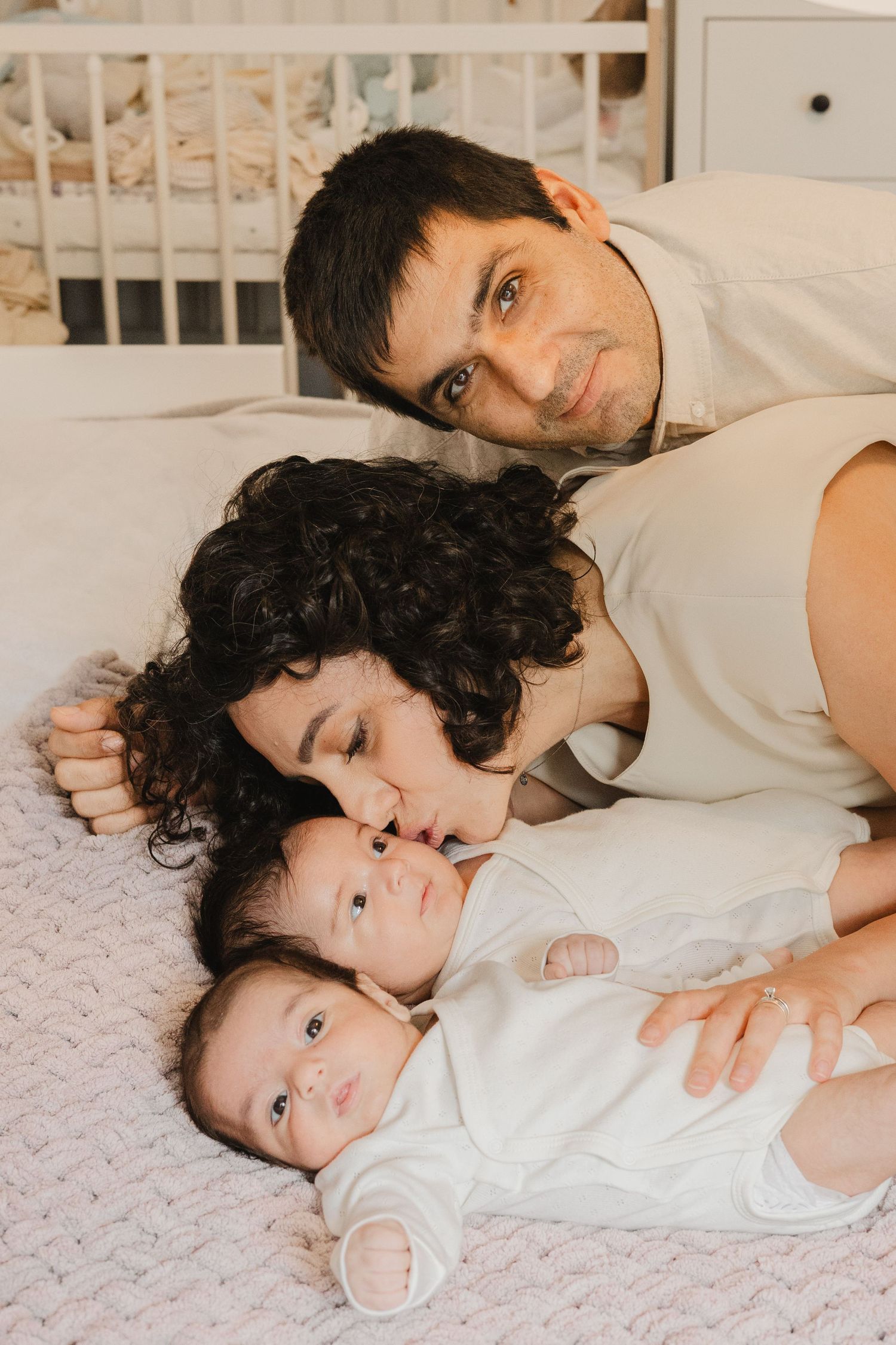 family photos of a family of twins