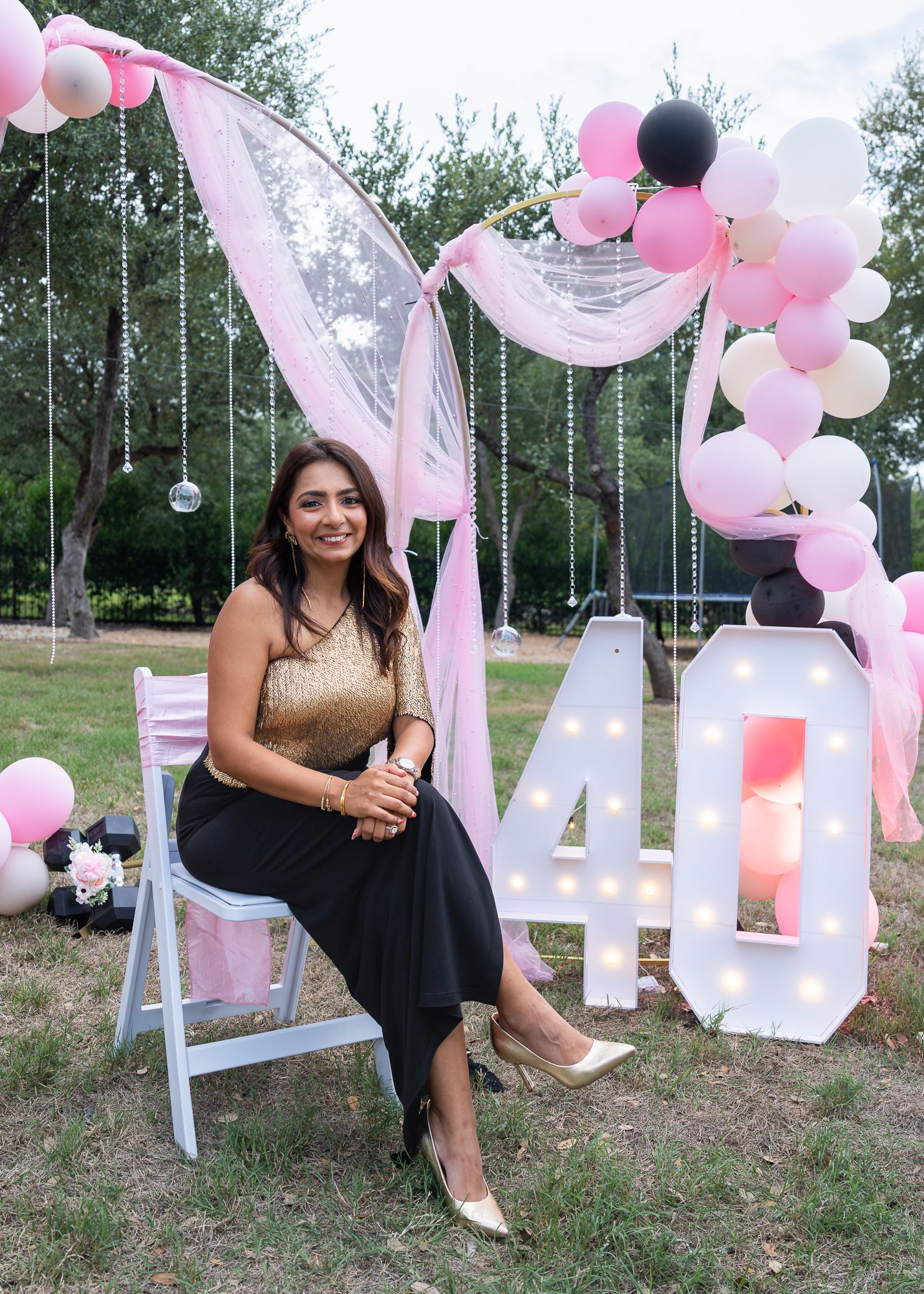 Woman celebrating her 40th birthday at an outdoor party