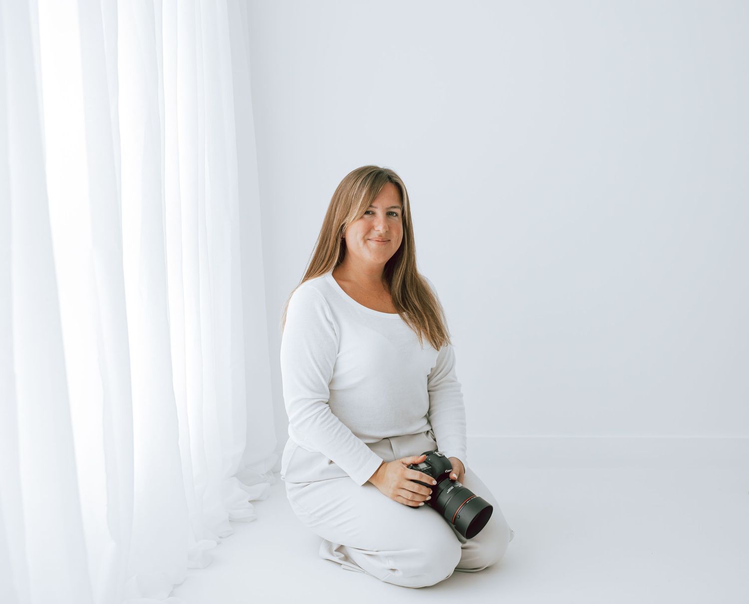 Rachael Plaxton holding a camera