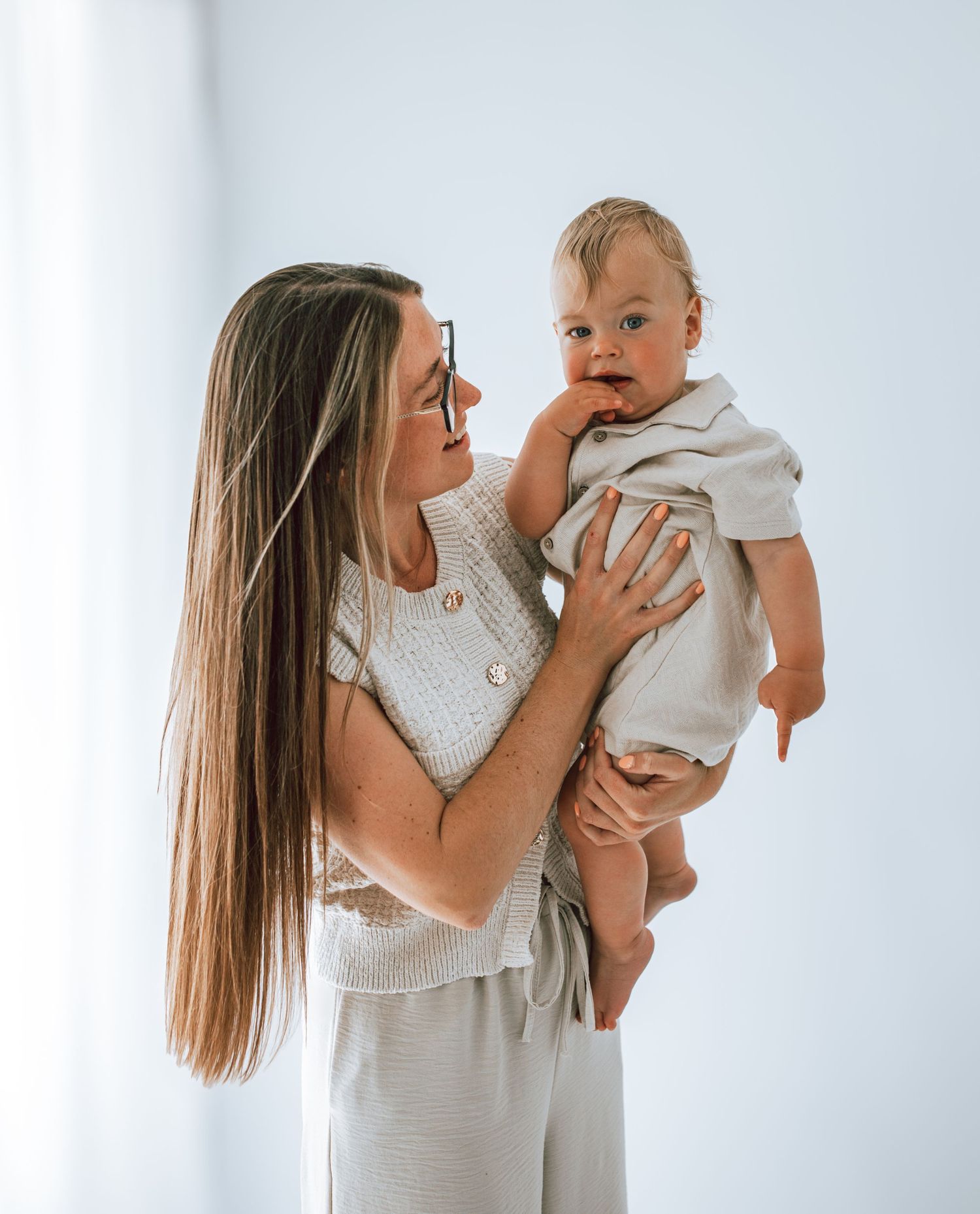 Mother holding her child for Mother's Day photoshoot