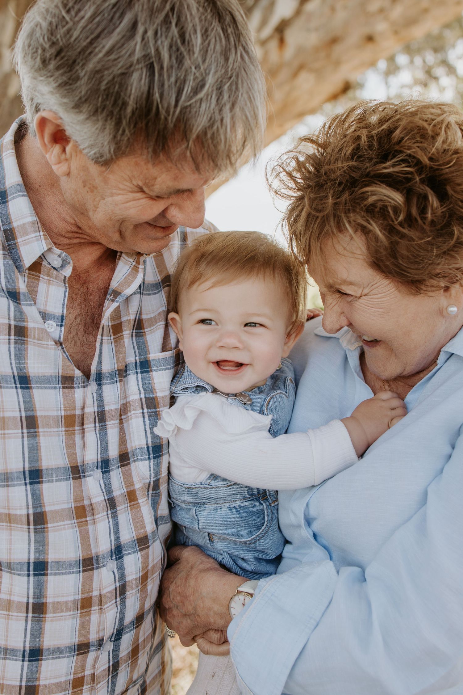 Family photography Adelaide - Adelaide family photographer - Grandparents with granddaughter portrait in Mclaren Flat