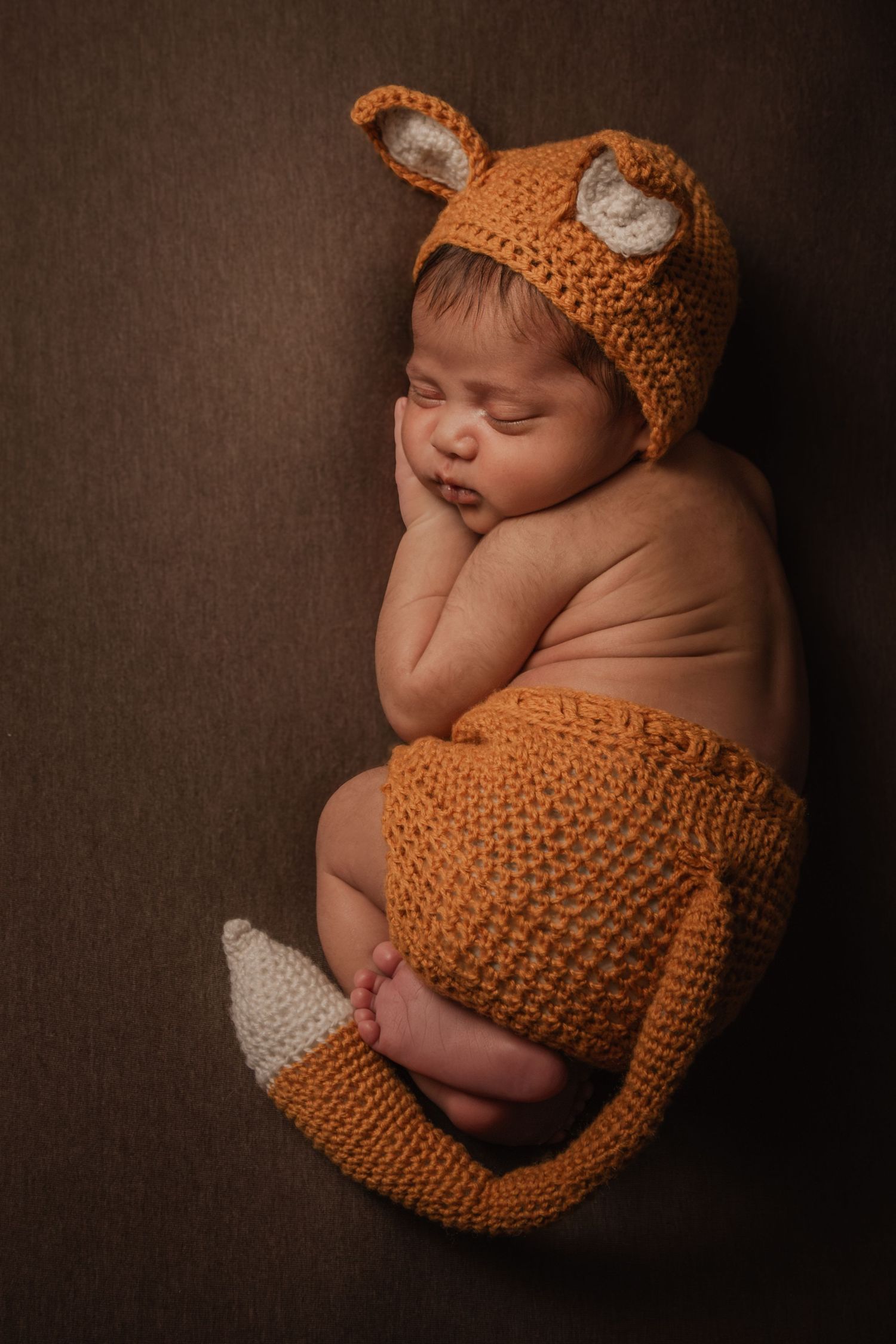 Newborn in fox outfit handmade props Mississauga Studio