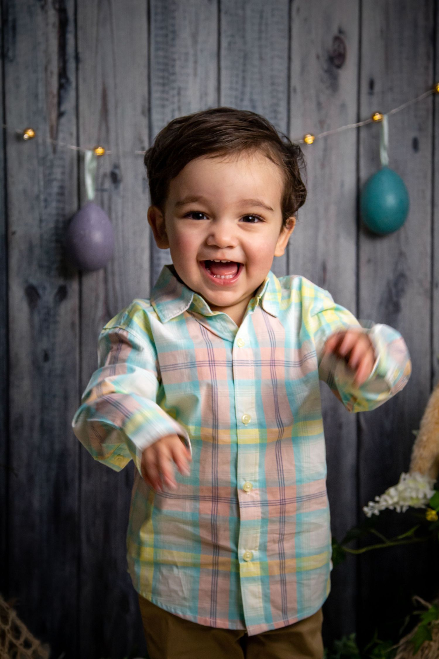 laughing toddler in easter photoshoot