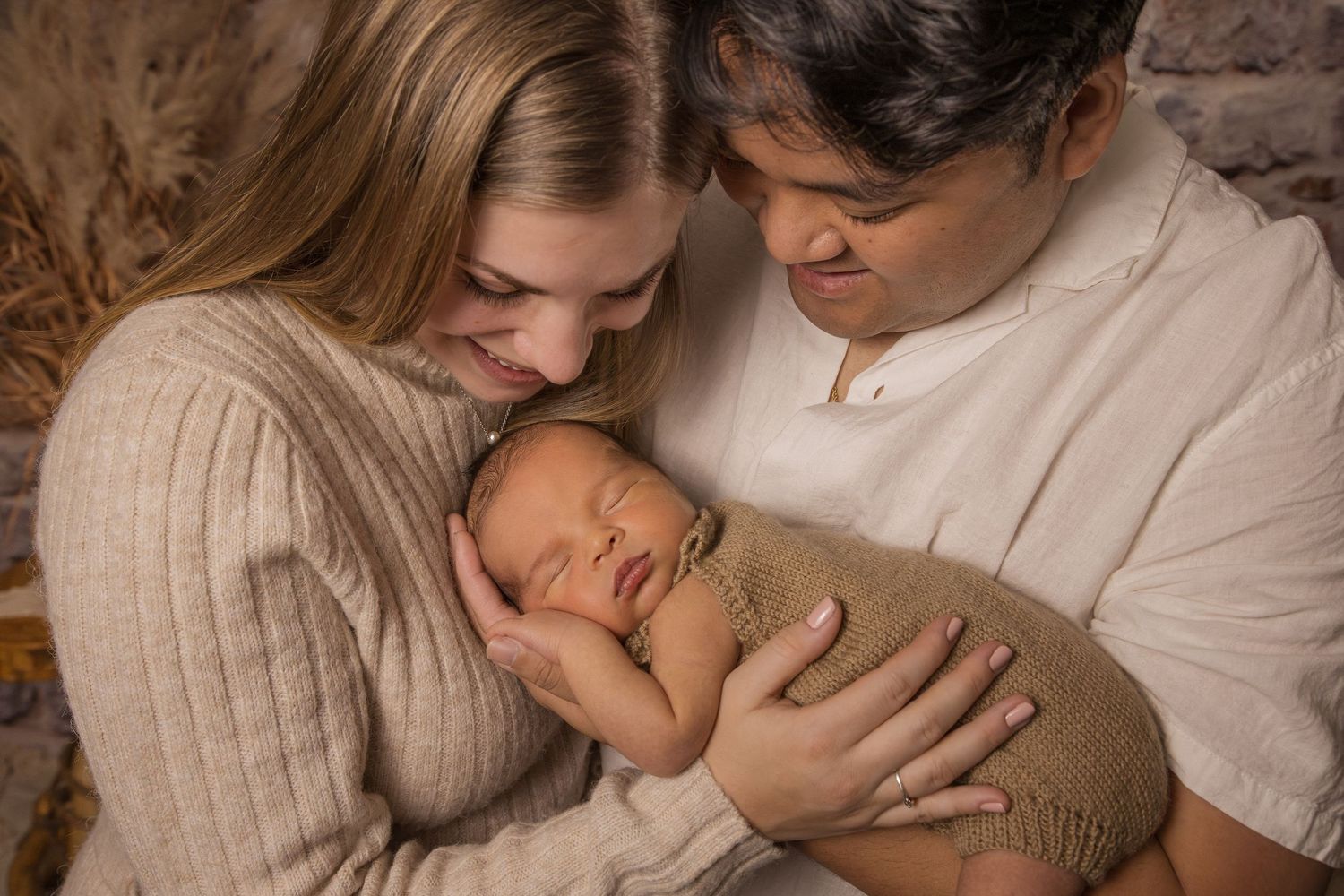 New parents holding baby Greater Toronto Area Photo Studio