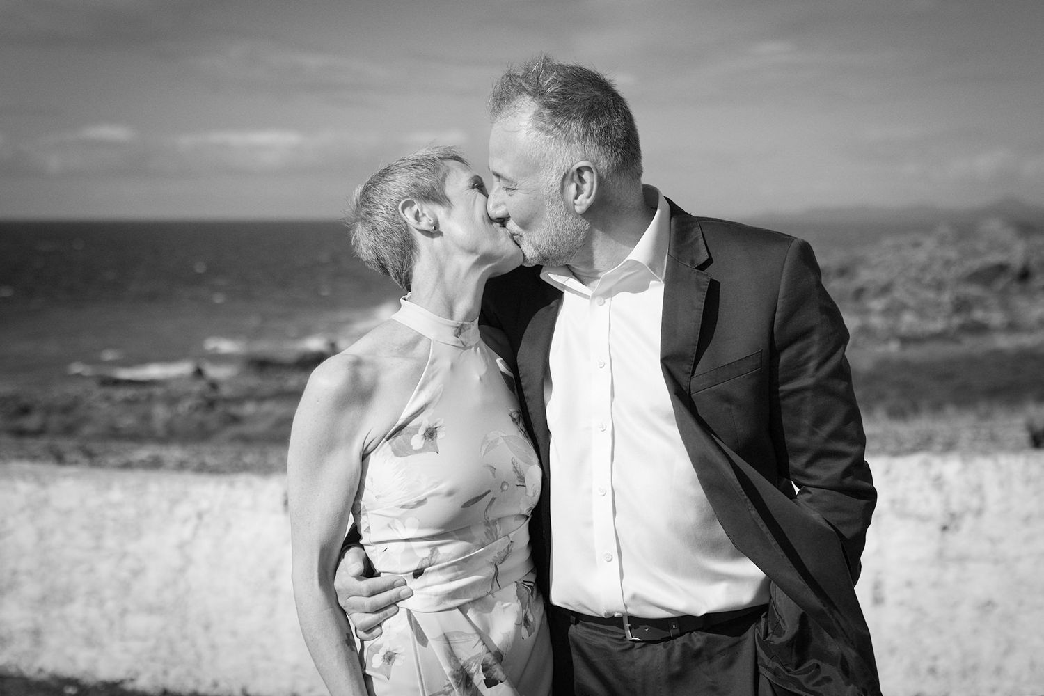 Wedding portrait, married couple kissing. monochrome