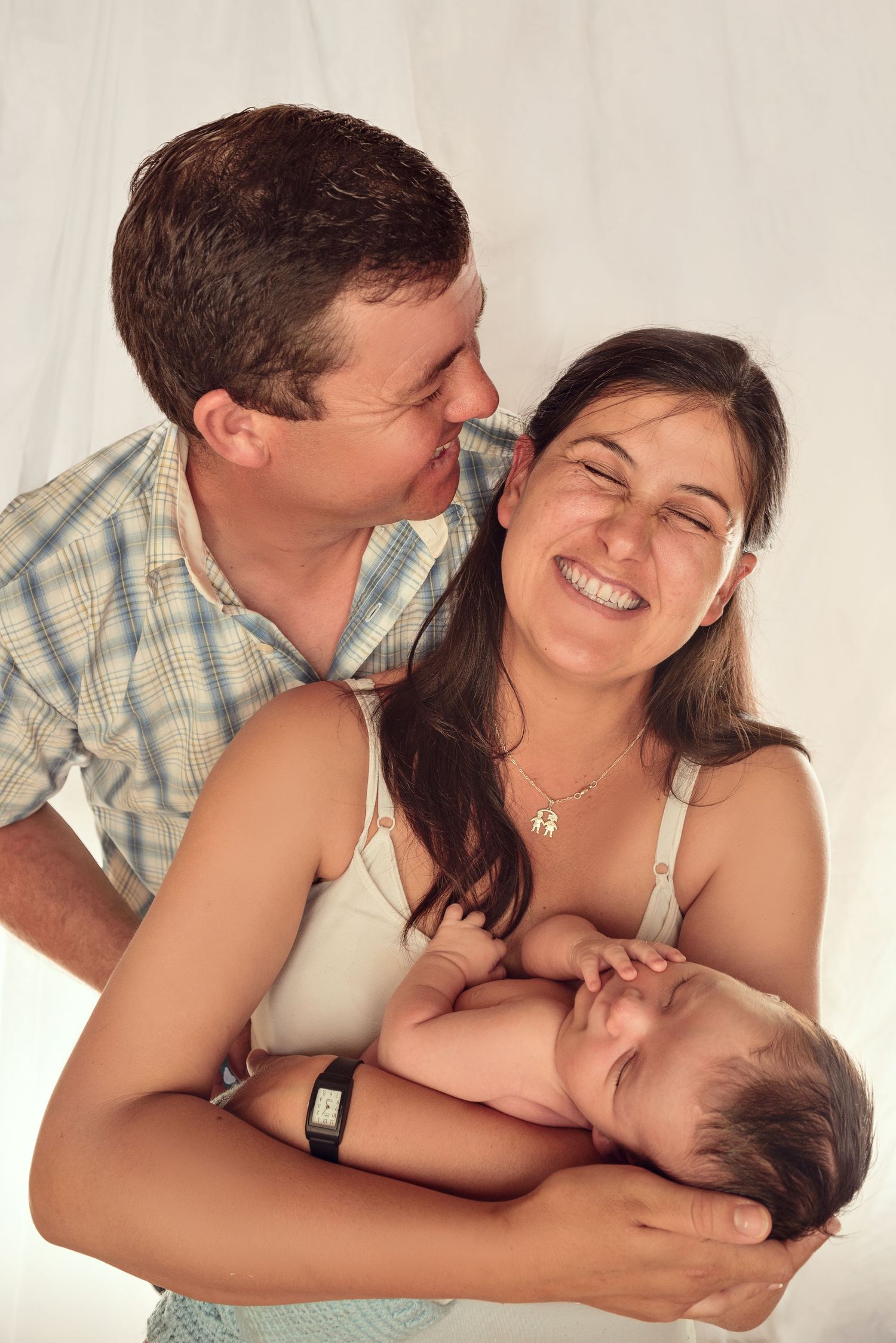 A loving couple shares tender moments in a series of romantic photos against a white background.