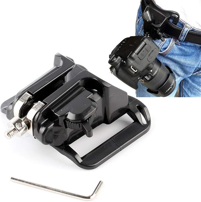 Black camera belt clip mount holster with quick release buckle, allen wrench included, shown attached to denim jeans.