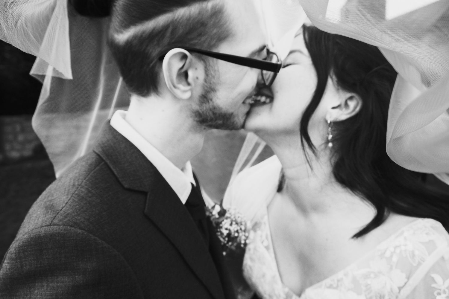Black and white romantic wedding photo showing intimate close-up moment between newlyweds taken by chesterfield wedding photographer