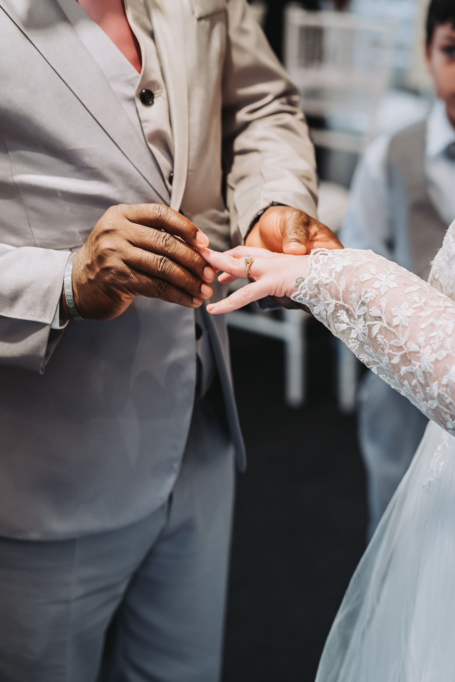 Close-up of wedding ring exchange at Chesterfield register office during ceremony taken by chesterfield wedding photographer 21 photography
