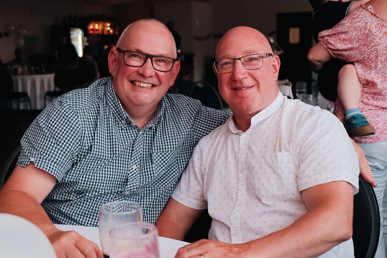 2 men enjoying beers at a family gathering shot in chesterfield by 21 Photography