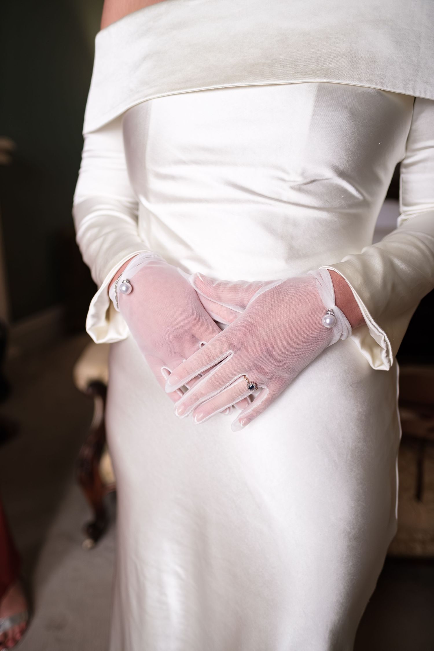 Dunston Hall Chesterfield wedding photography Bride in white off-shoulder gown wearing sheer gloves