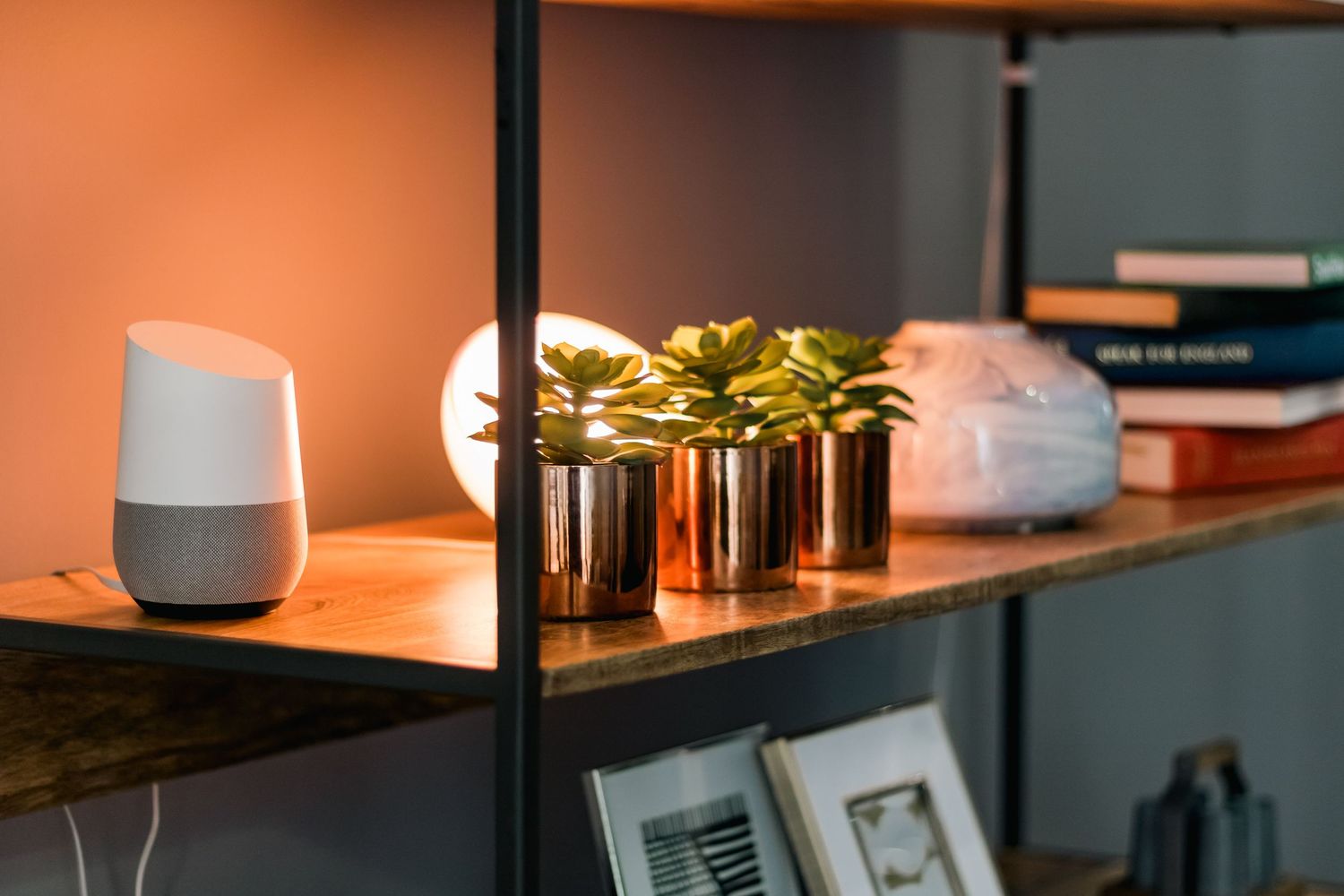 Smart home setup with Google Home speaker and decorative gold planters on modern shelf shot in Leeds by 21 Photography