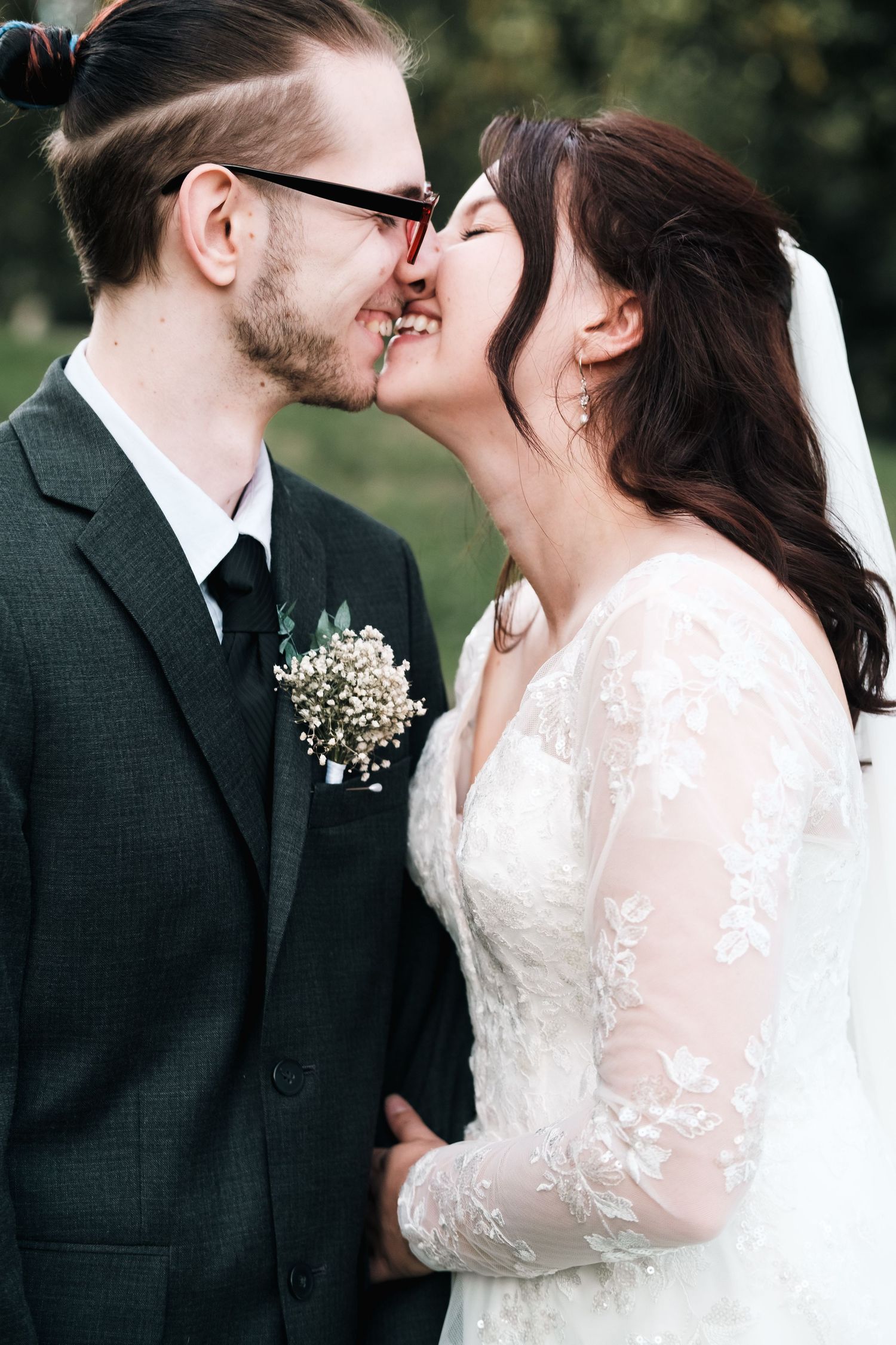 A romantic wedding moment captured in a series of four intimate photos showing a couple in formal attire outdoors.