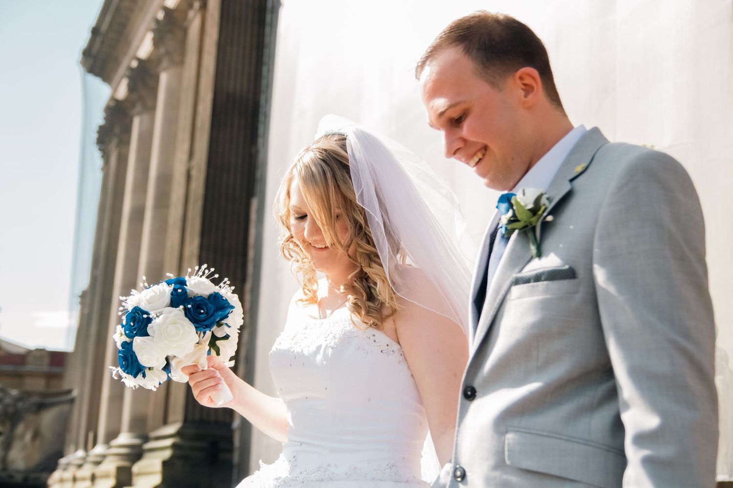 Wedding couple shares intimate moment in indoor portrait session.