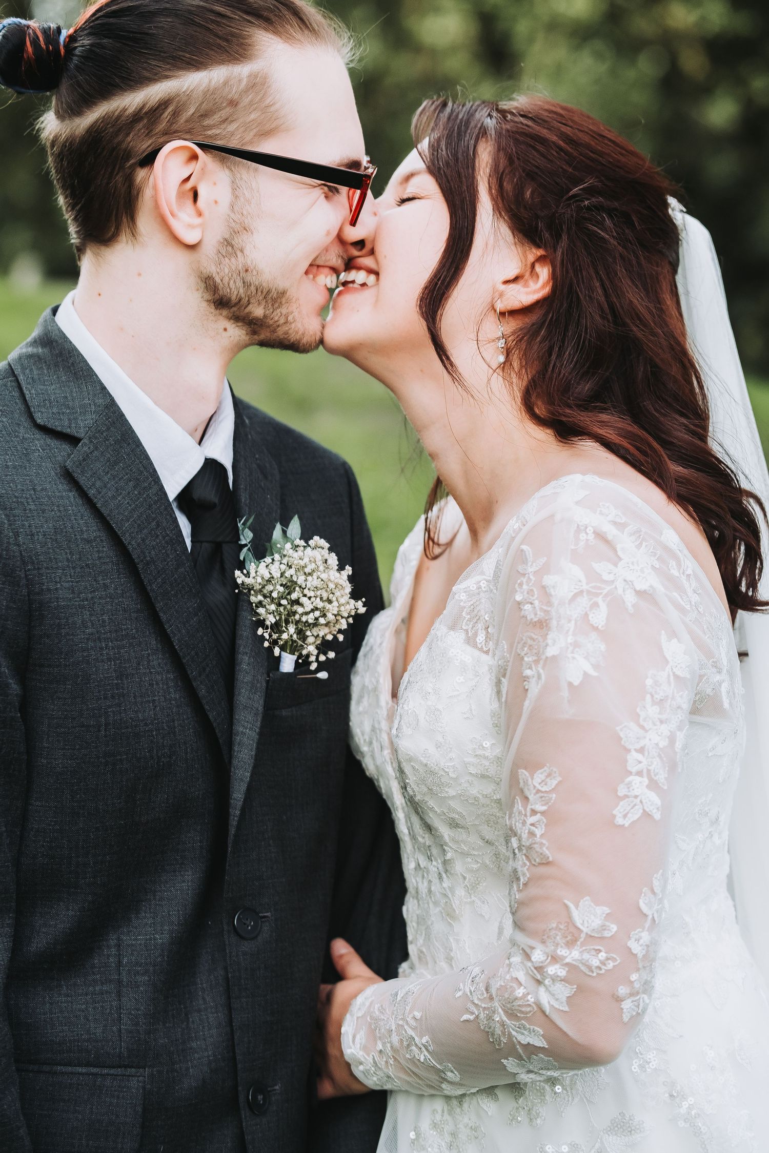 Close-up wedding portraits showing tender moments between newlyweds.