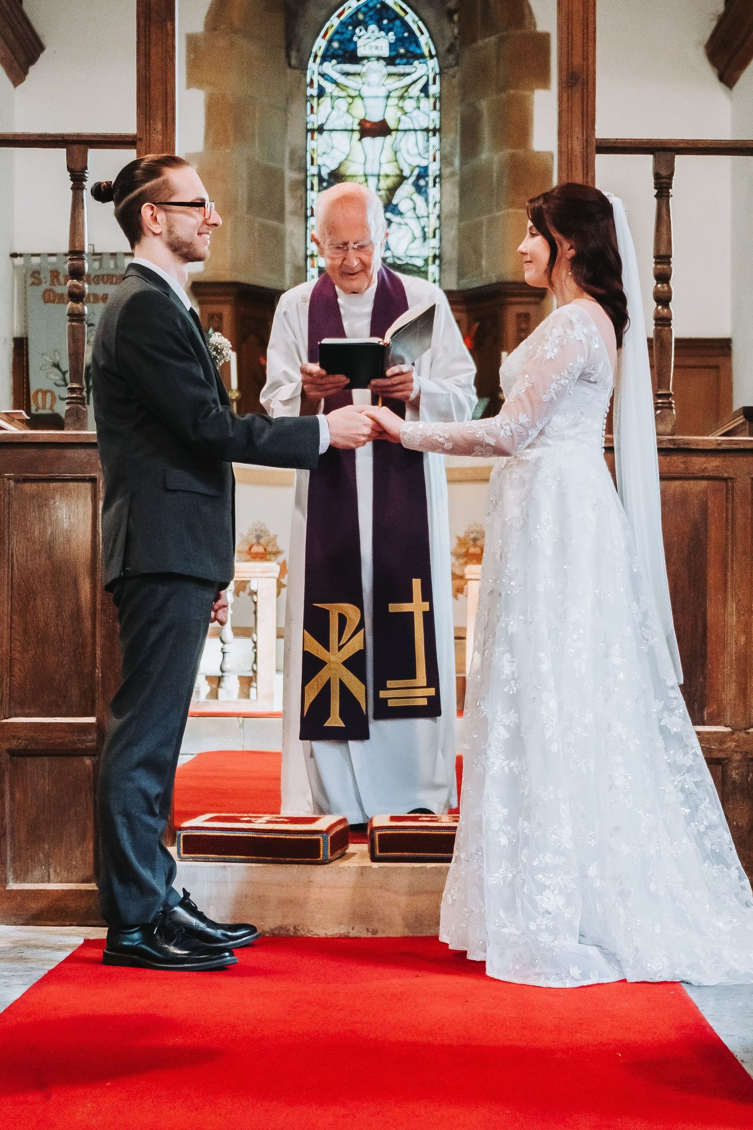 A series of candid moments showing a couple dancing and laughing during their church wedding ceremony.
