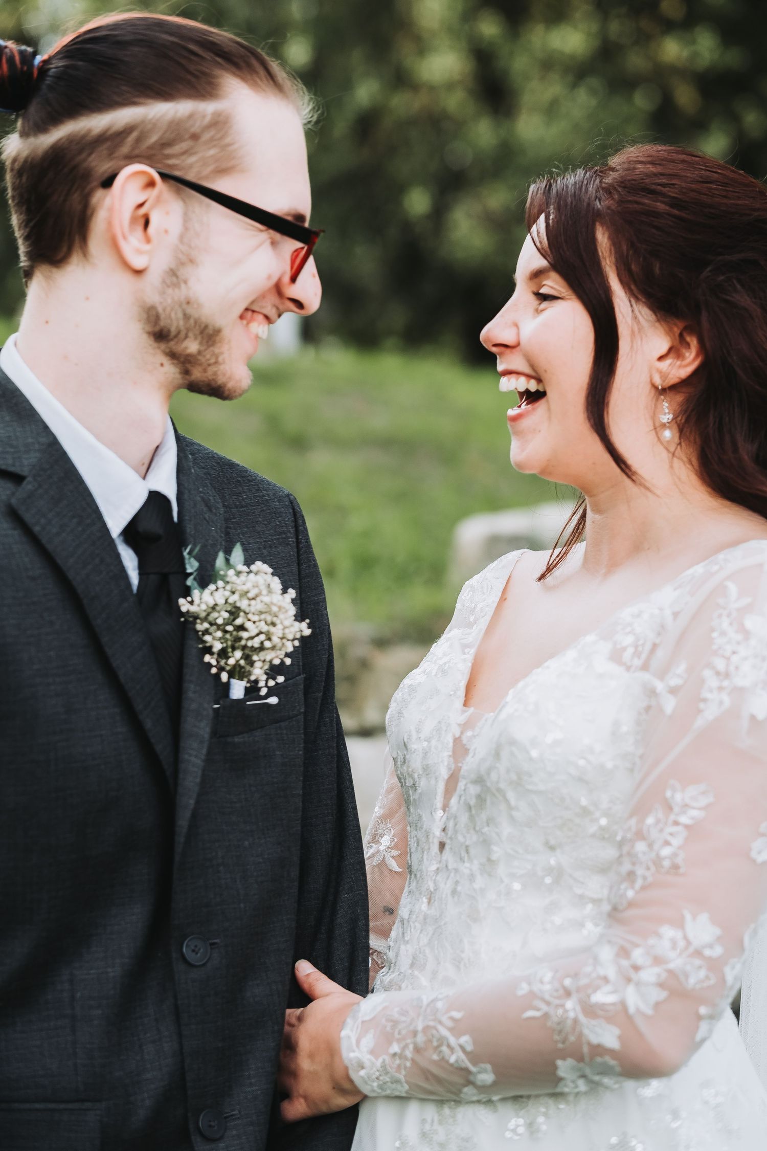 Close-up wedding portraits showing joyful laughter and tender moments between the couple.