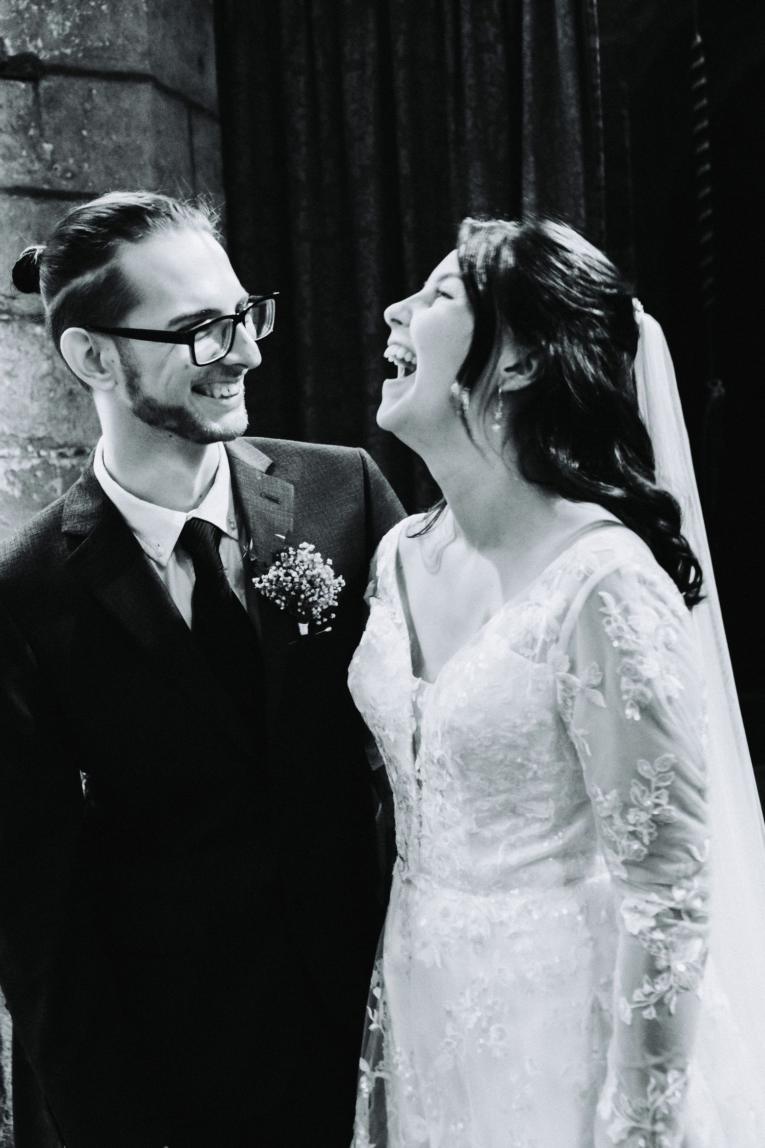 A romantic black and white wedding photo series showing tender moments between a bride and groom.