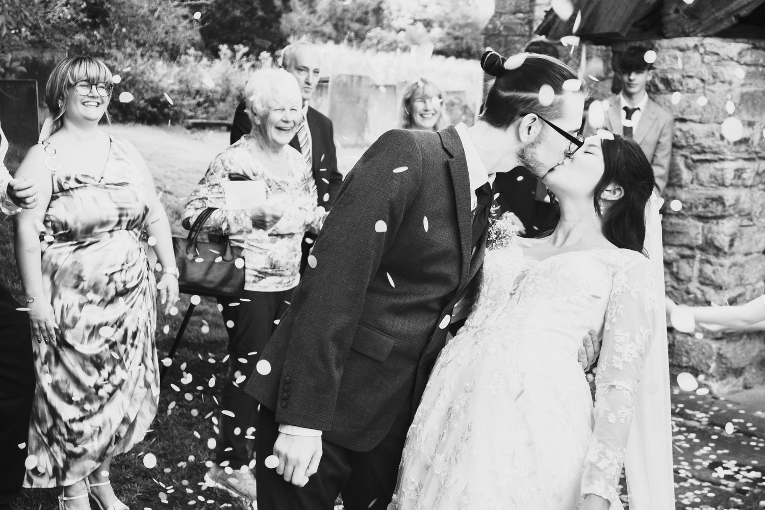 A vintage black and white wedding photograph showing couple kissing taken by chesterfield wedding photographer 21 Photography