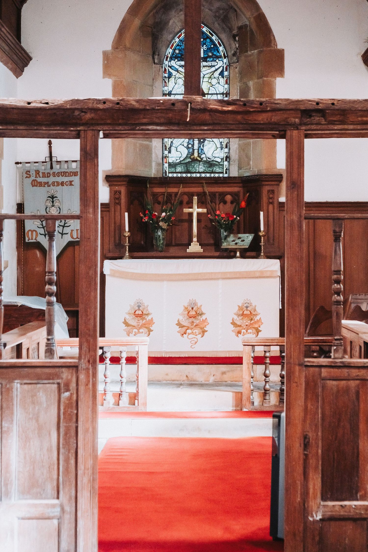 Natural light filling St Radegund’s Church during Tyson and Rebecca’s intimate vow renewal in Derbyshire.