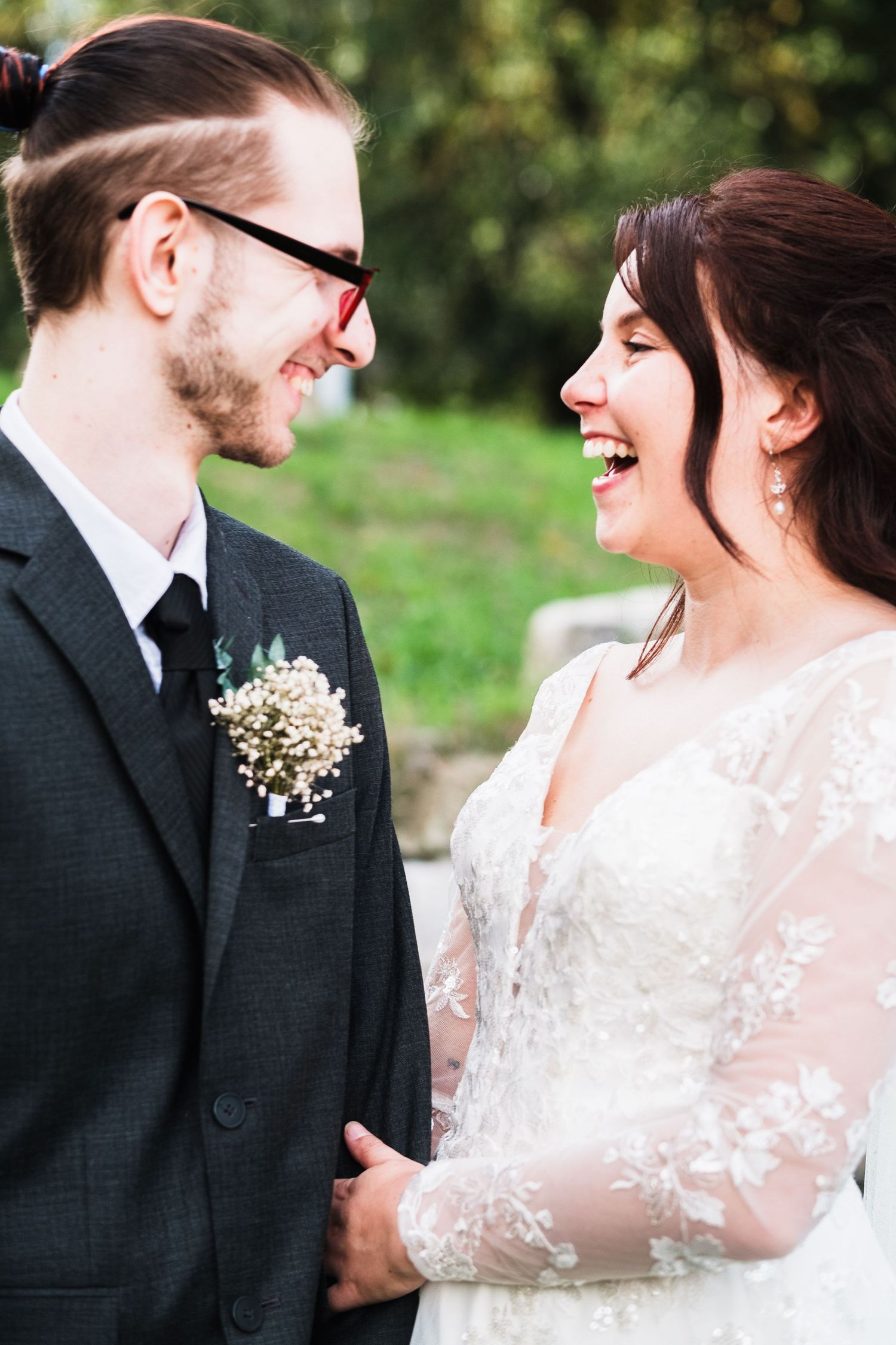 A bride and groom joyful laughter in a series of romantic outdoor wedding photos taken by chesterfield wedding photographer 21 Photographer