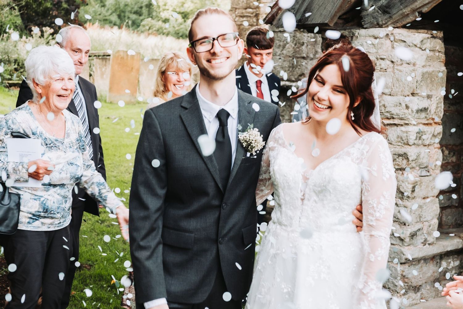 Tyson and Rebecca enjoying joyful confetti moments with family and friends in Derbyshire