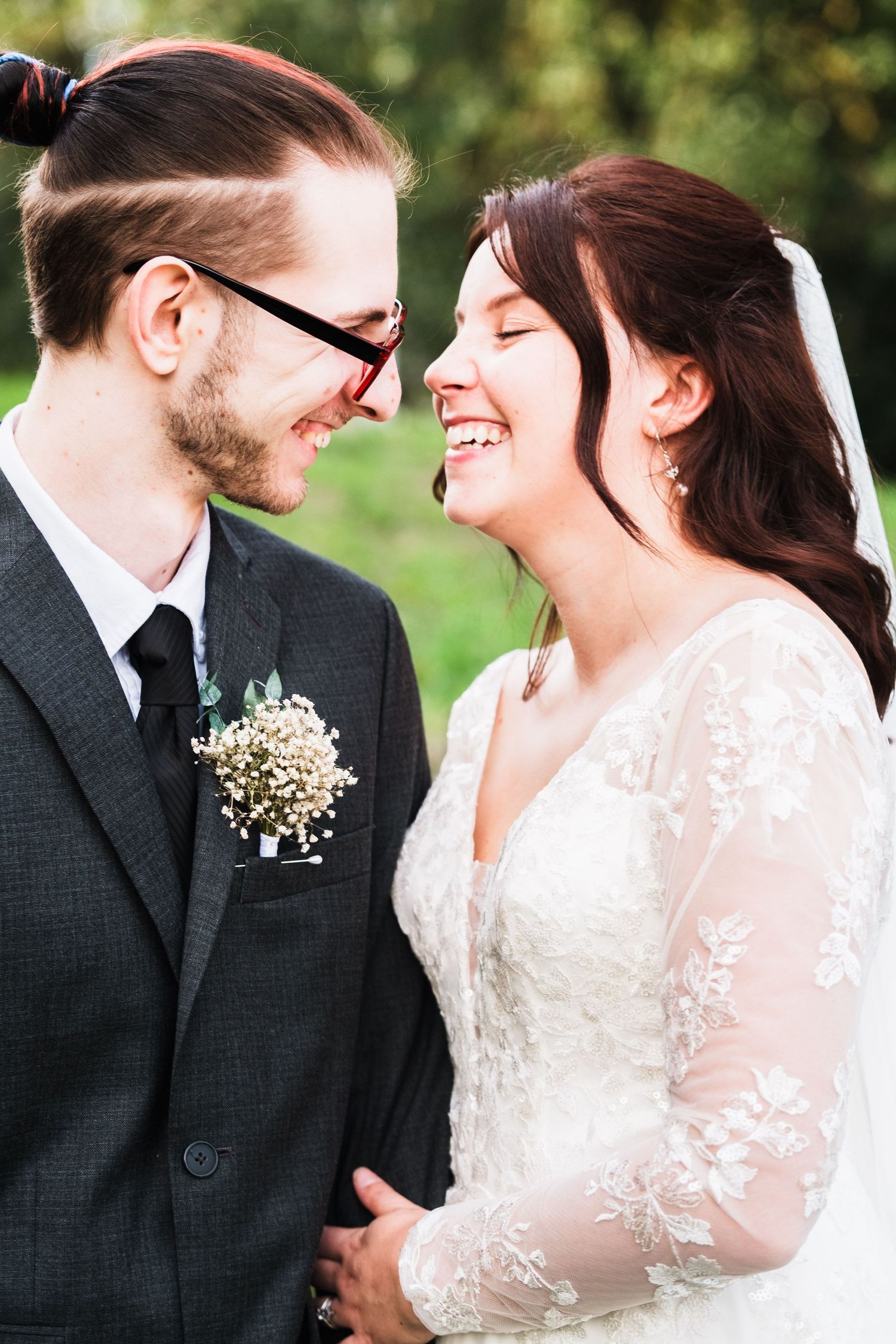 A bride and groom joyful laughter in a series of romantic outdoor wedding photos taken by chesterfield wedding photographer 21 Photographer
