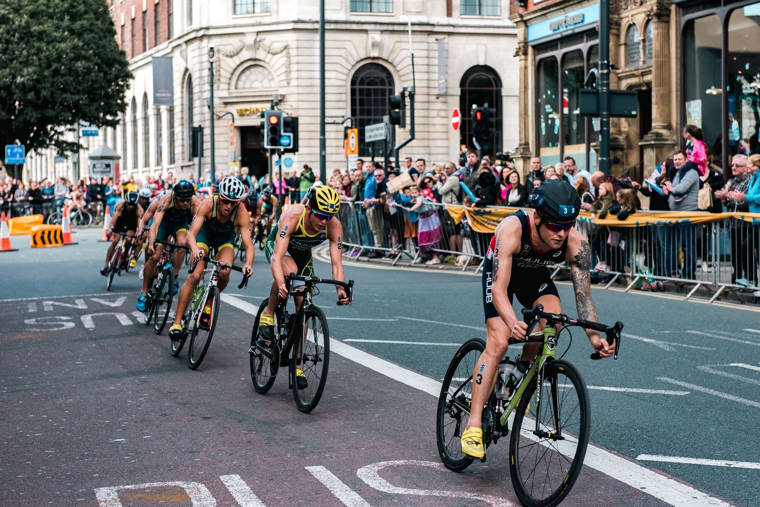 Group of cyclists racing through city streets during competitive event shot in Leeds by 21 Photography