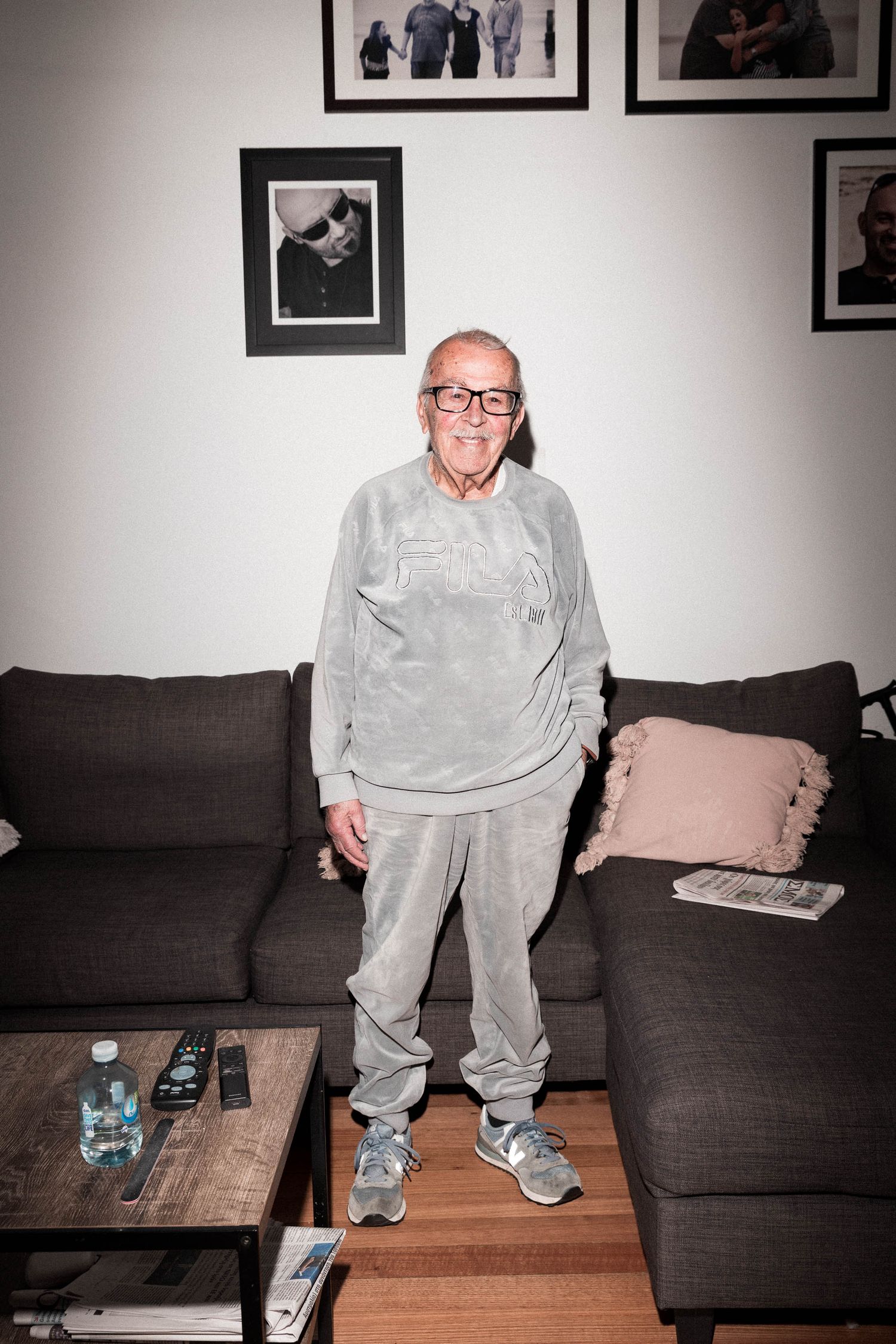 An at home portrait taken by Chapter Portraits Melbourne. An elderly gentleman in a matching tracksuit, in his favourite place, home.
