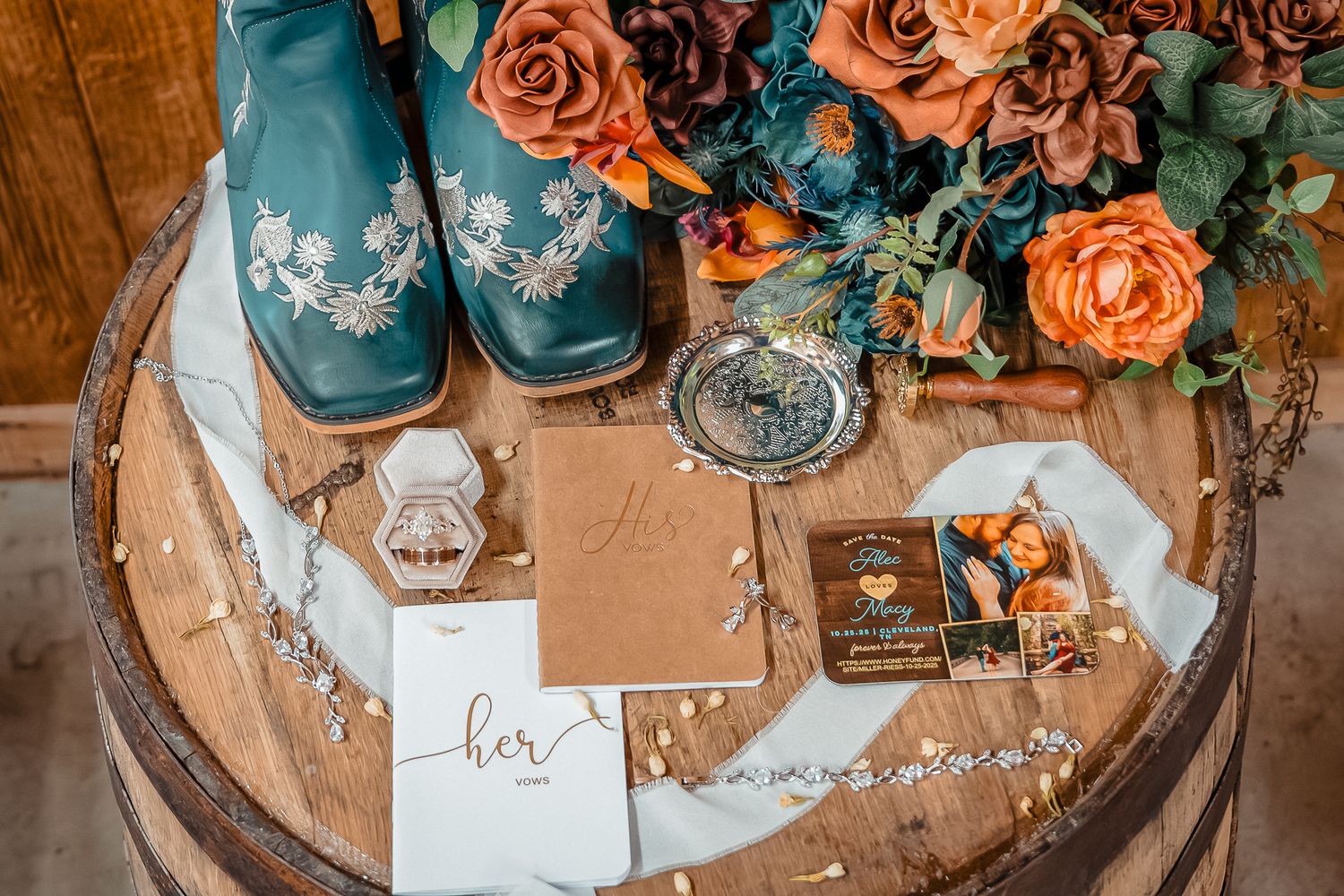 Wedding decor featuring peach roses and turquoise accents on a rustic table setting.