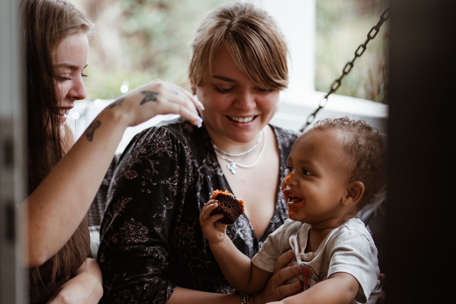 Candid moments captured during a casual gathering around a dining table.