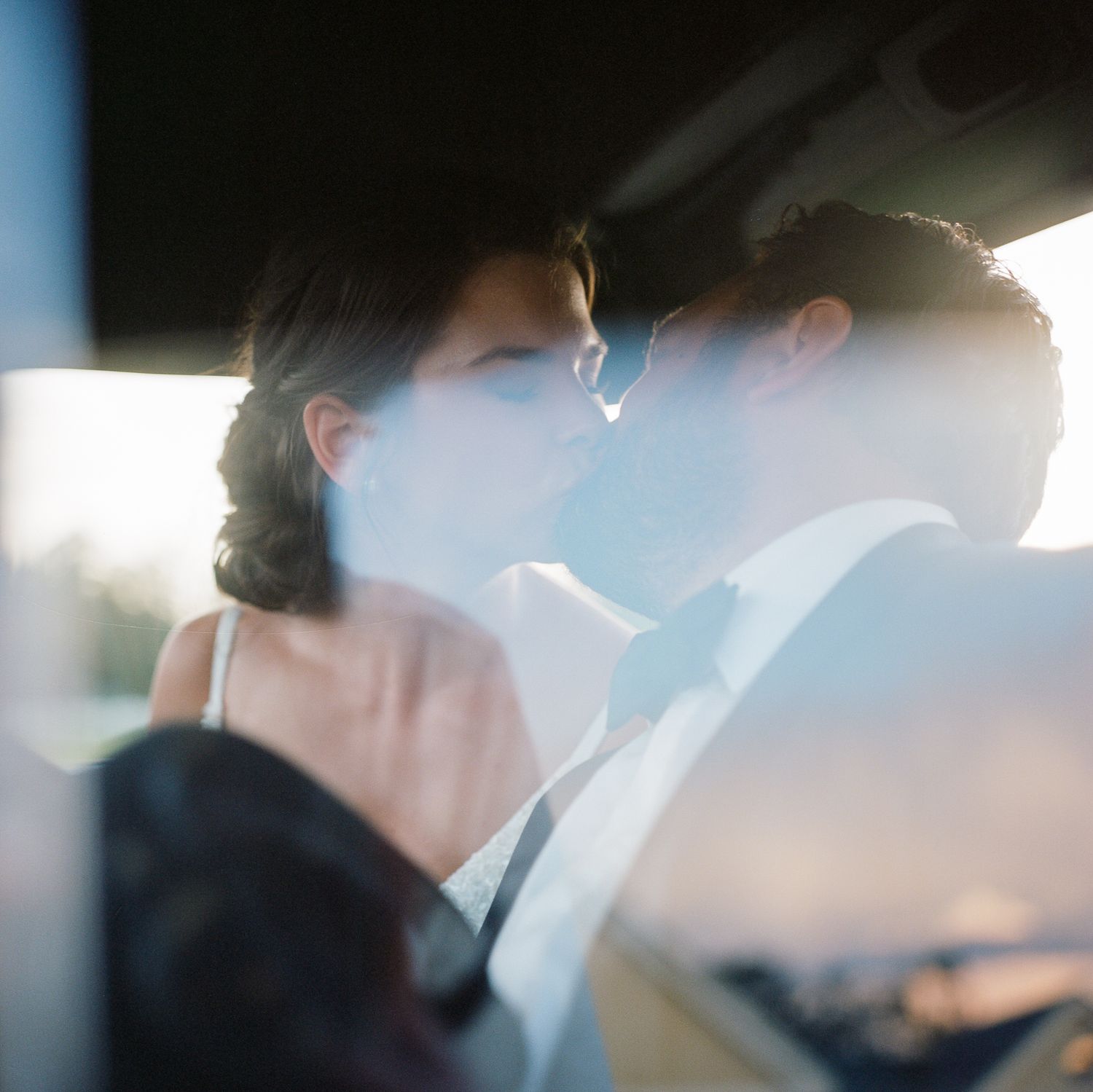 Artistic blurred wedding photo with soft focus and natural lighting.