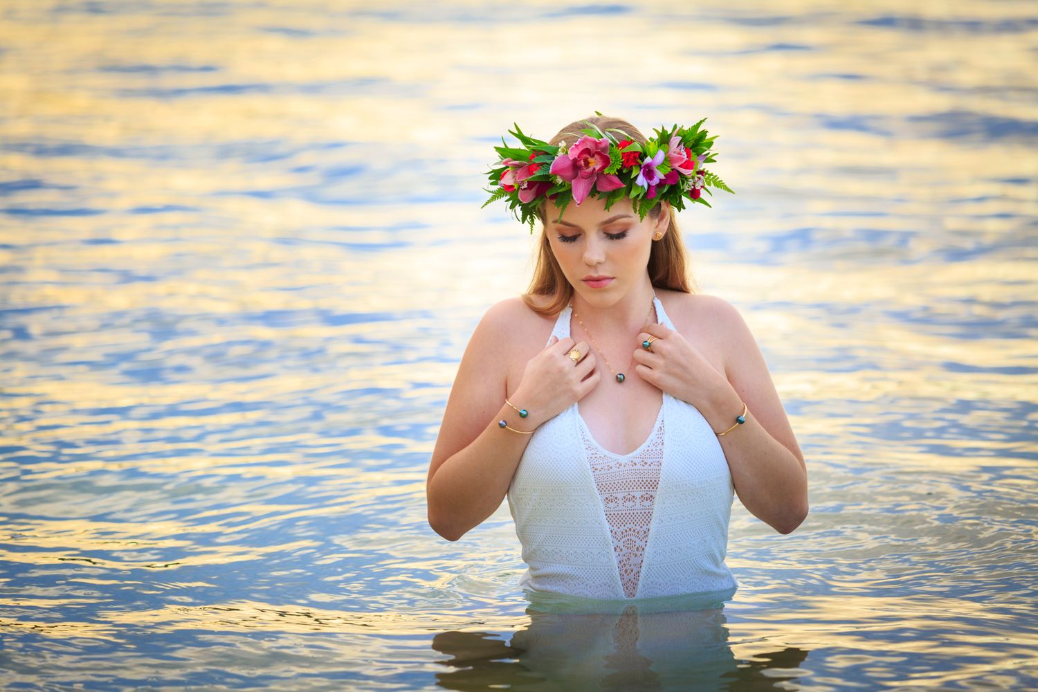 Ethereal water photography session at golden hour with floral crown and soft lighting.