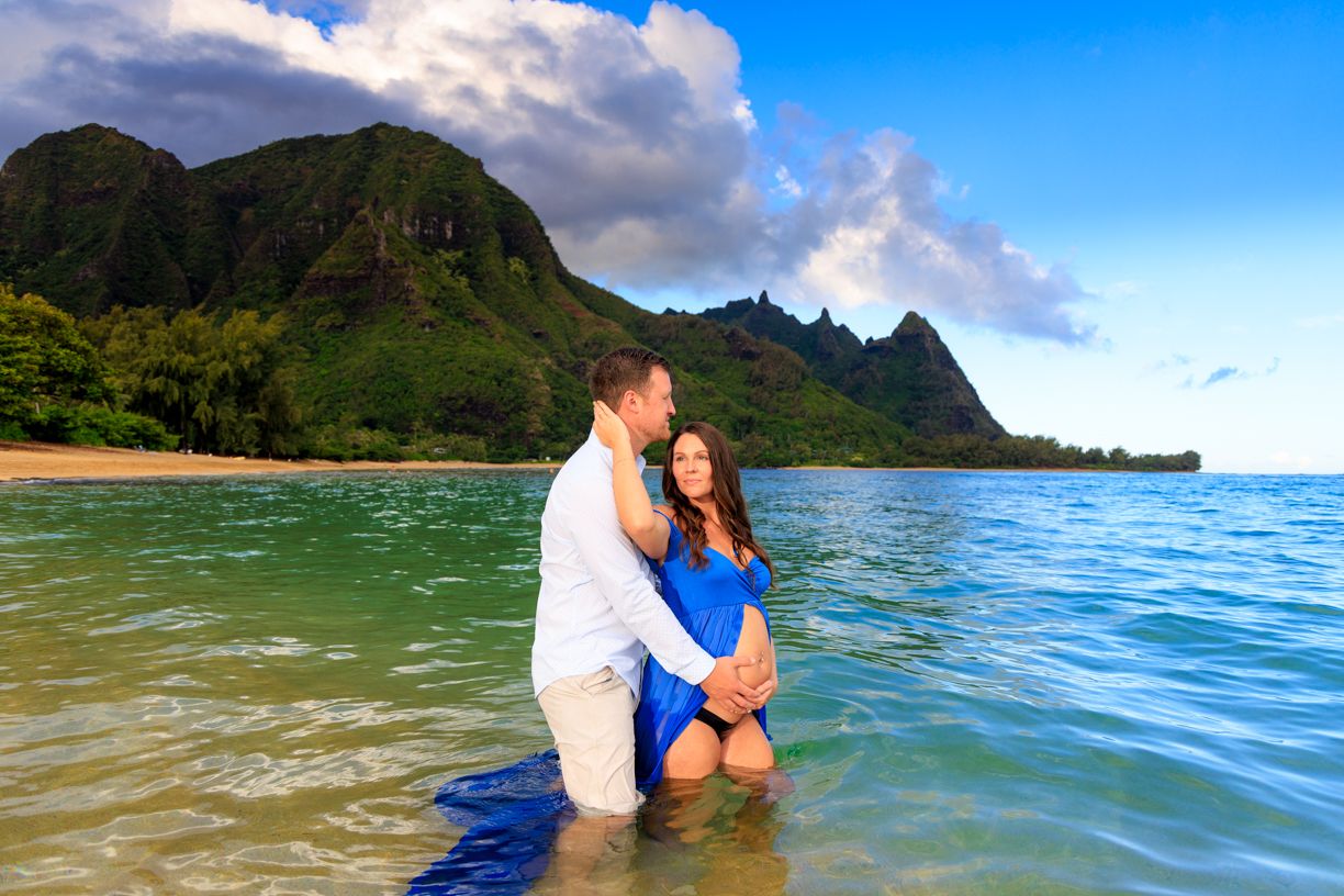 Romantic beach photos with mountains and blue waters creating a stunning tropical backdrop.