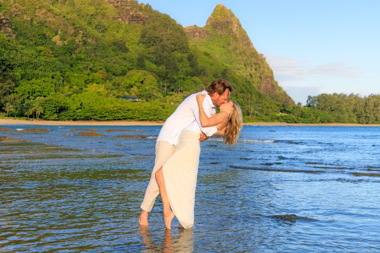 Romantic beach portrait with iconic Bali Hai mountain peak in background.