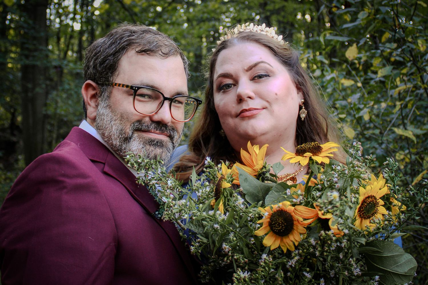 A series of autumnal engagement photos in a forest with burgundy outfits and vibrant sunflowers creating romantic moments.