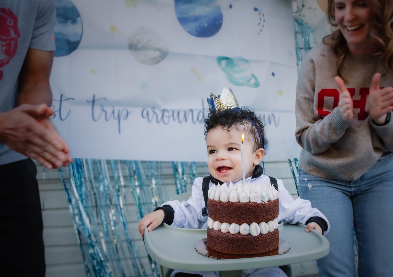 Collage of a first birthday celebration with blue accents featuring cake smash photos and party decorations.