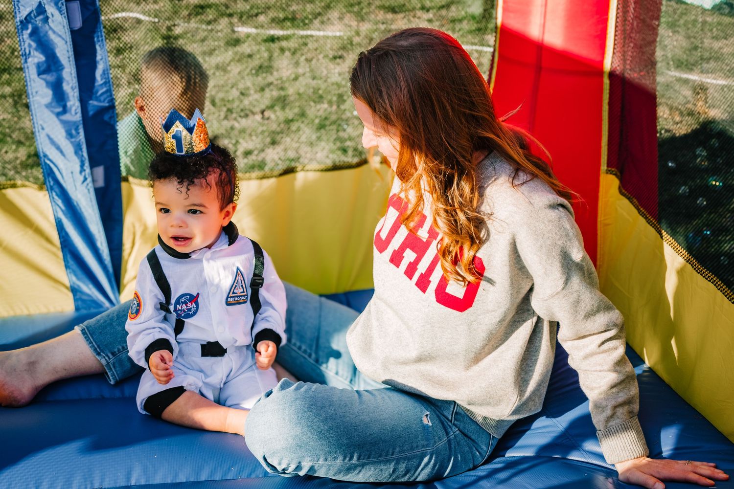 Children play and interact with colorful educational materials in a learning environment.