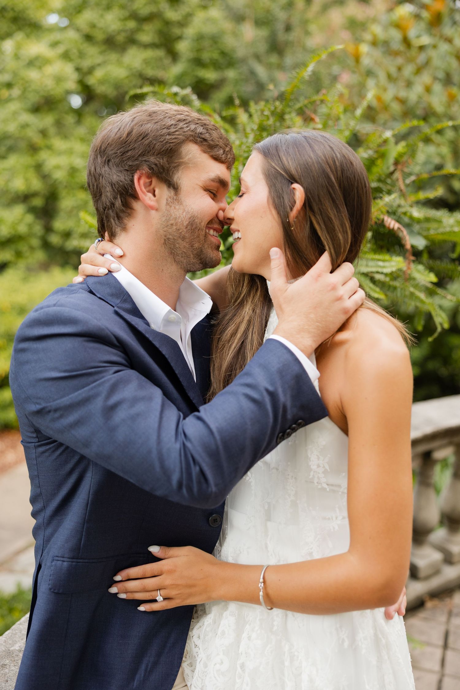 A romantic wedding photo sequence showing a couple kissing in a garden setting with greenery in the background.