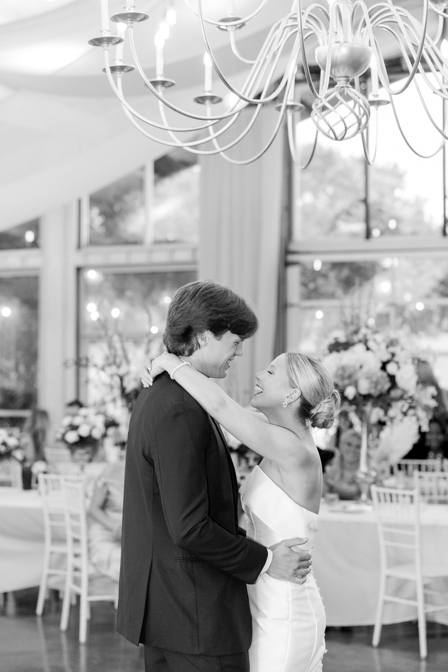 Elegant ballroom wedding reception with chandelier and romantic dance. Cold Springs Events