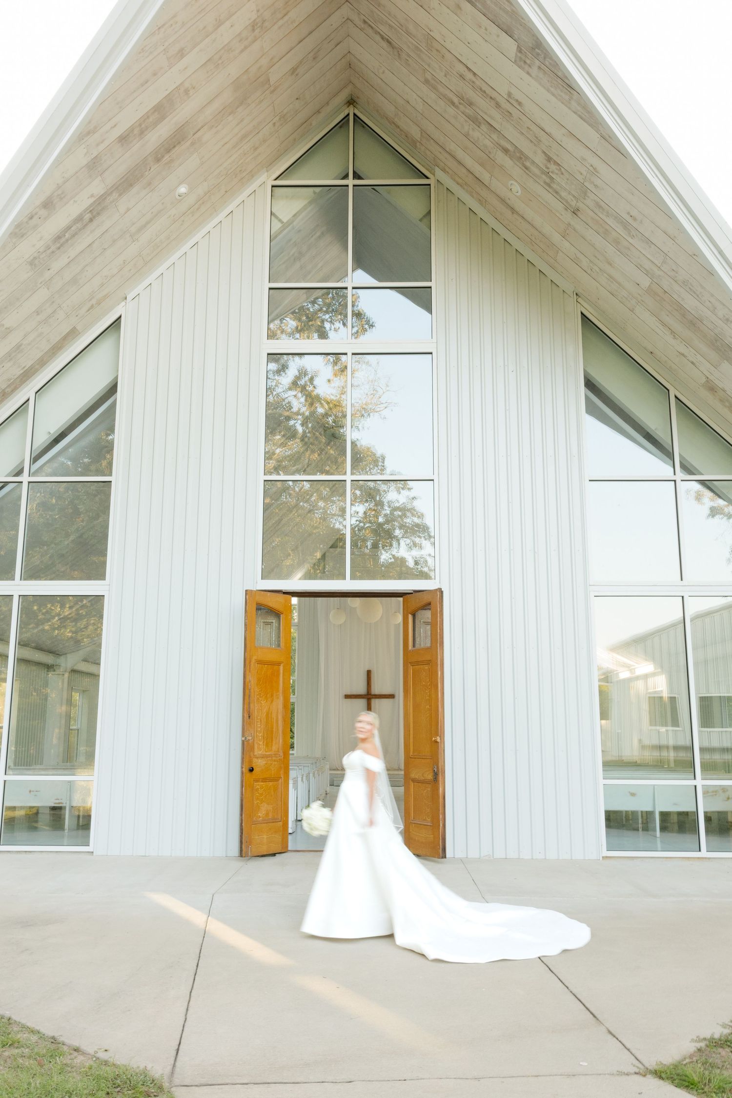 A series of shots showing a white church exterior with A-frame architecture and wooden doors.