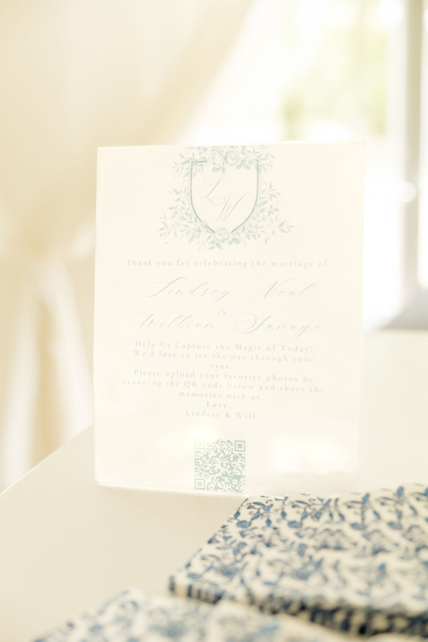 Delicate white place cards with blue calligraphy arranged for a formal event.Cold Springs Events